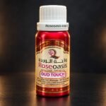 Roseoasis Oud Touch perfume oil 100g bottle on a dark studio background