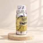 Surrati Bwlgari perfume oil bottle on a pale travertine pedestal
