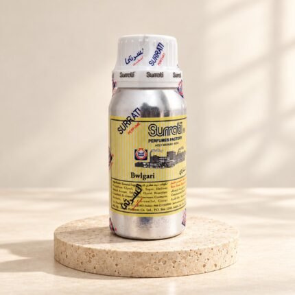 Surrati Bwlgari perfume oil bottle on a pale travertine pedestal