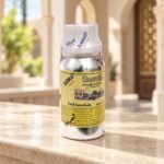Surrati Oud Interlude perfume oil bottle in an elegant daylight setting