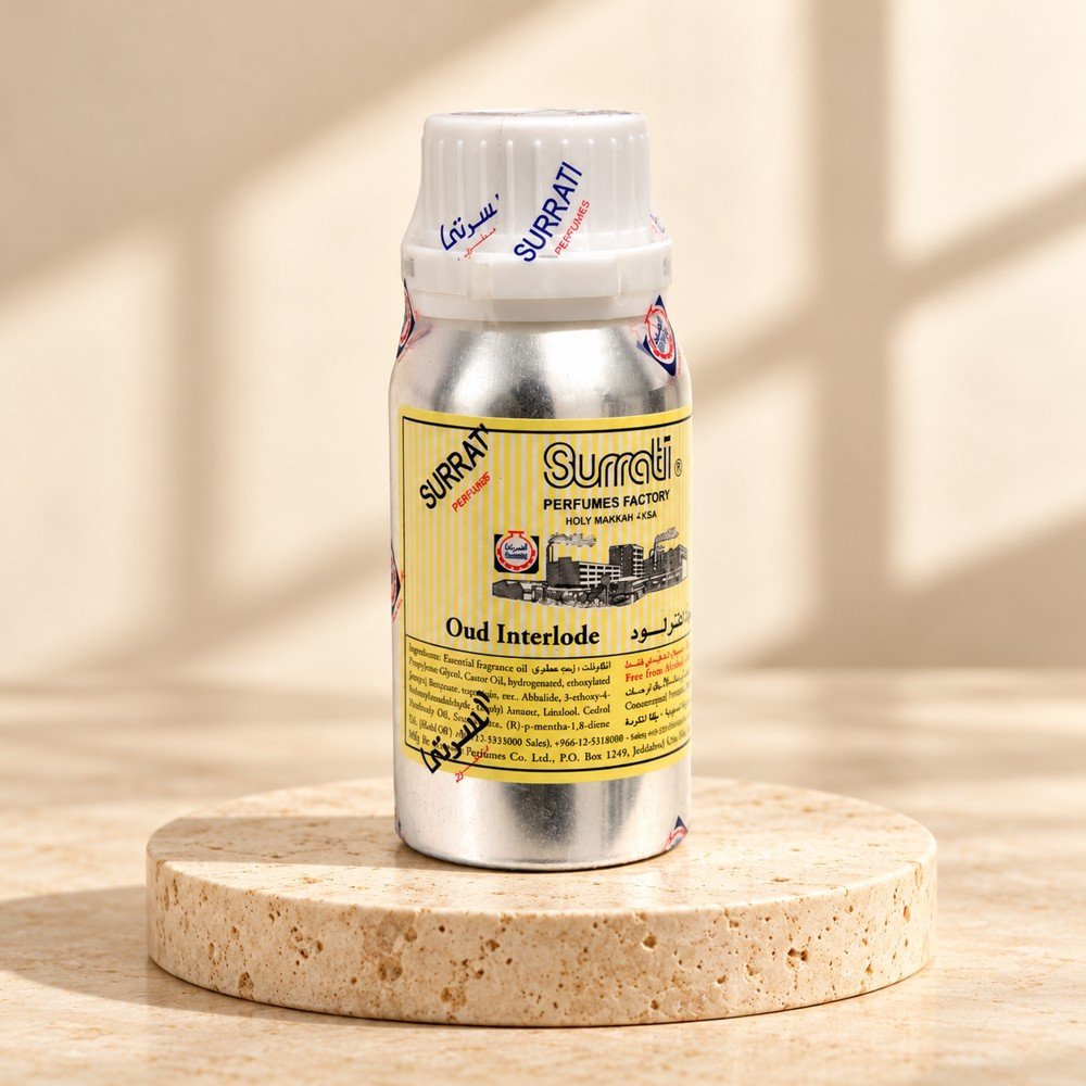 surrati-oud-interlude-main Surrati Oud Interlude perfume oil bottle on a pale travertine pedestal