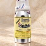Close-up of Surrati XXS perfume oil bottle and label