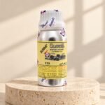 Surrati XXS perfume oil bottle on a travertine pedestal